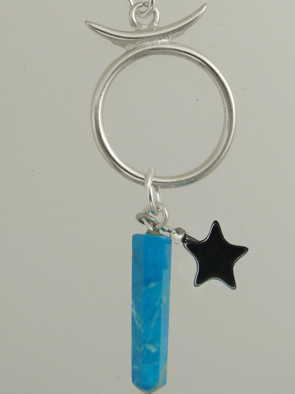 Sterling Silver Taurus Pendant Necklace With an Turquoise And a Black Onyx Star